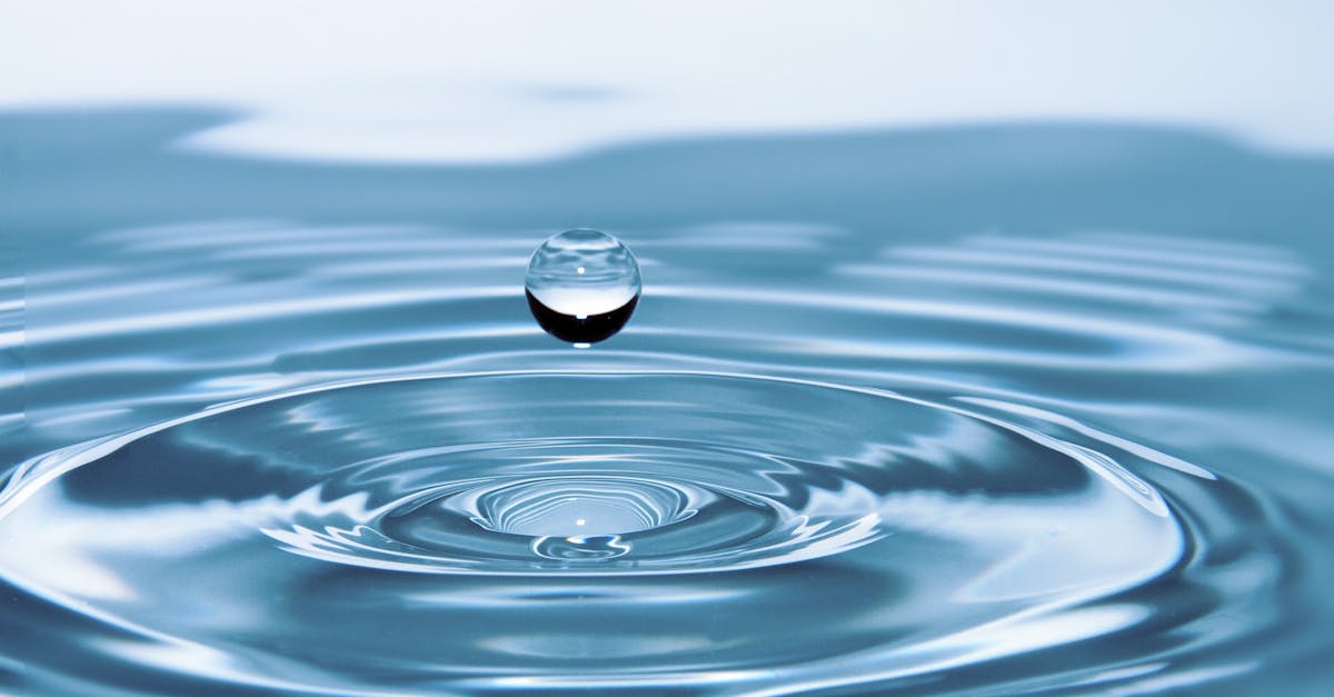 A mesmerizing shot of a water droplet capturing the beauty of liquid dynamics.